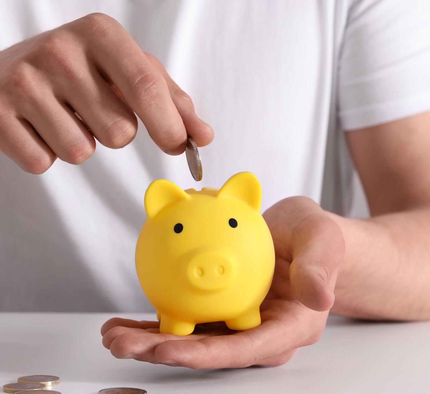 Yellow piggy bank for savings and pension