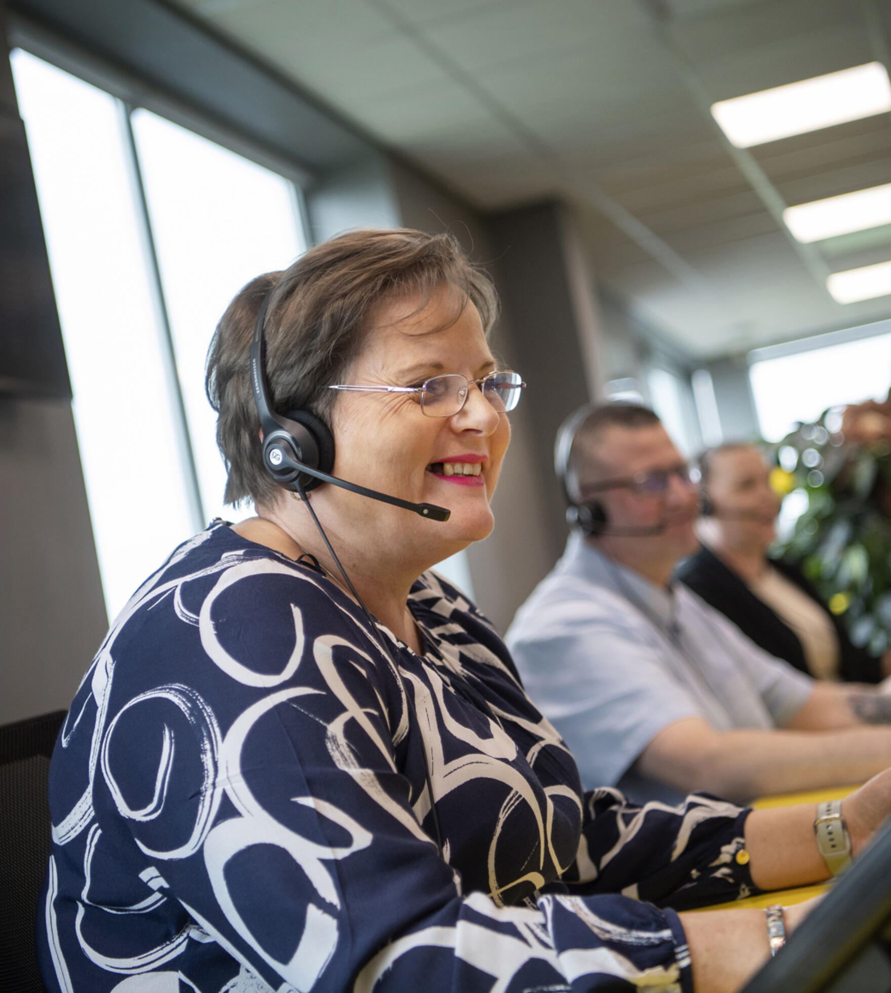 Lemon Contact Centre operator smiling whilst wearing headset