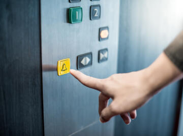 Yellow emergency lift call button