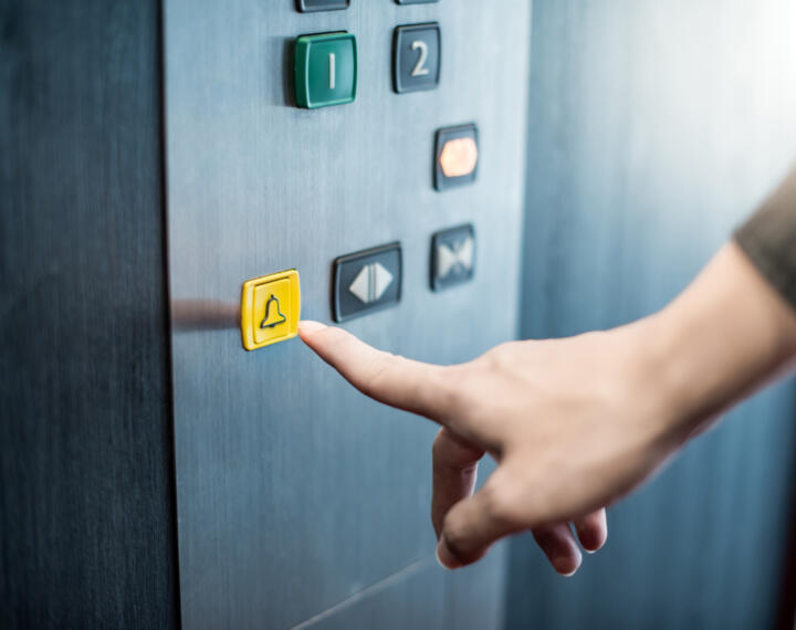 Yellow emergency lift call button