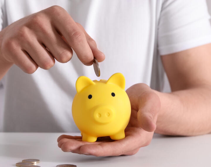 Yellow piggy bank for savings and pension